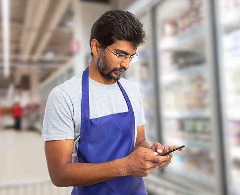 store worker on phone