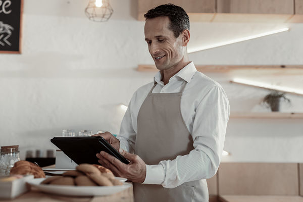 restaurant owner on tablet